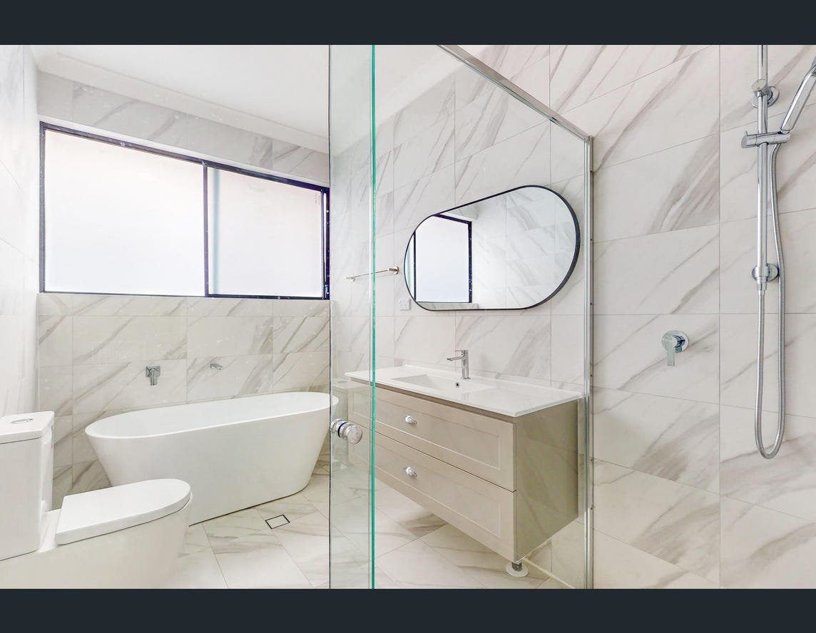 Finished Blacktown bathroom with bath, vanity and shower screen, March 2024 listing photograph